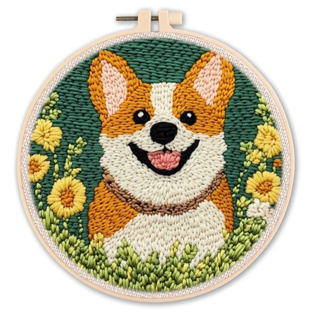 Embroidery of a corgi dog surrounded by flowers in a wooden hoop.