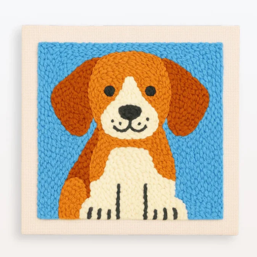 Embroidered picture of a dog on a blue background