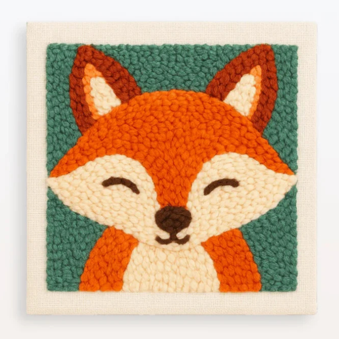 Woven wall art of a fox face with a green background
