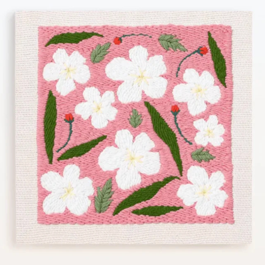 Woven fabric with white flowers and green leaves on a pink background