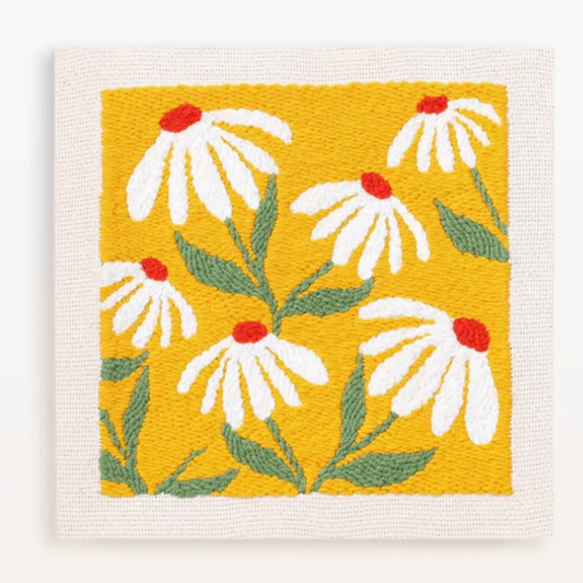 Woven fabric with white flowers and red centers on a yellow background